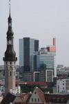 Tallinn. Contrast between church tower and modern city
