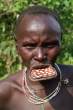 Go to big photo: Muri woman with plate in the mouth - Omo Valley - Ethiopia