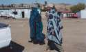 Go to big photo: Lesotho women wearing blankets